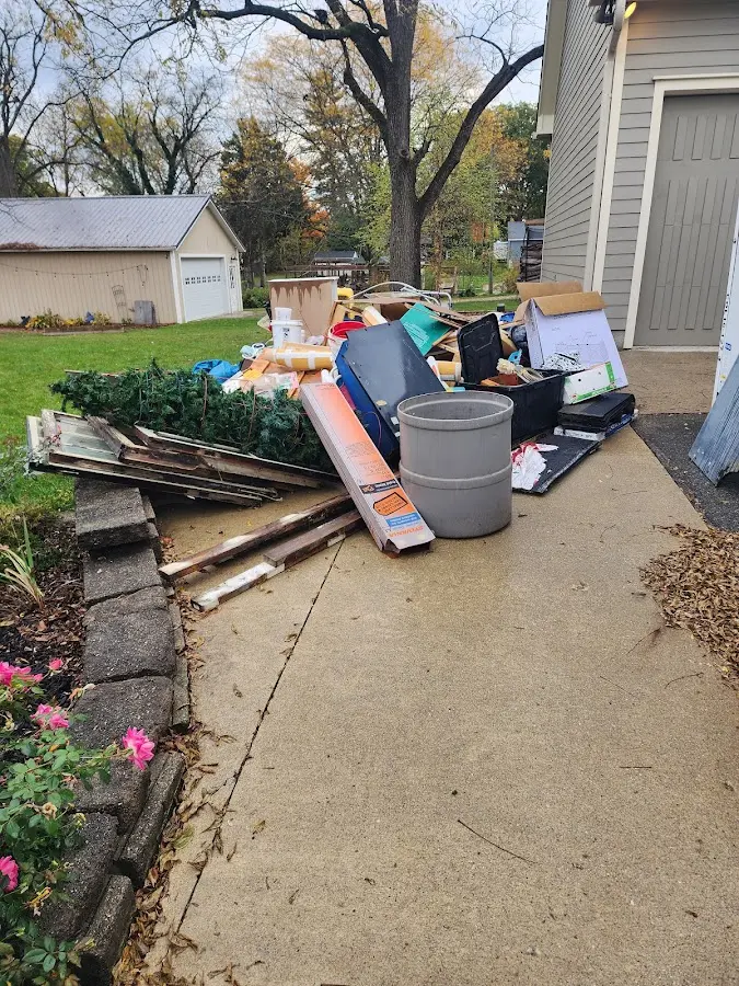 Dumpster being loaded with debris for Demolition Dumpster Rental in Rutland